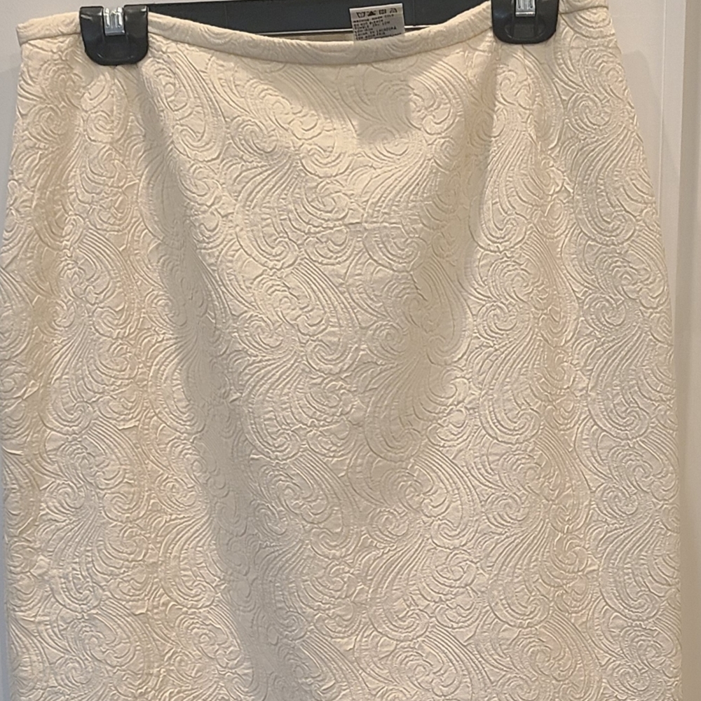 Polyester embossed print creme skirt